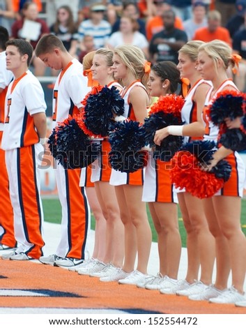 CHAMPAIGN,IL-AUGUST 31: Illinois cheerleaders line the end zone just prior to the game against SIU on Saturday, Aug 31, 2013.