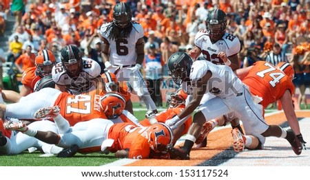 CHAMPAIGN,IL-AUGUST 31: Illinois running back Donovonn Young (5) dives into the end zone for a touchdown during the second quarter of a game against SIU on Saturday, Aug 31, 2013.
