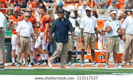 CHAMPAIGN,IL-AUGUST 31: Illinois head coach Tim Beckman checks the scoreboard just before the start of the second quarter on Saturday, Aug 31, 2013.