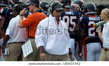CHAMPAIGN,IL-SEPTEMBER 28: University of Illinois football coach Tim Beckman paces back and forth in front of the Illini bench during a game against Miami-OH on Saturday, Sept 28, 2013.