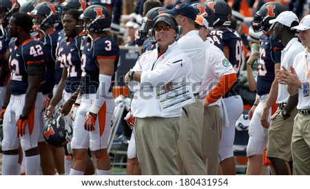 CHAMPAIGN,IL-SEPTEMBER 28: University of Illinois head football coach Tim Beckman pensively looks at the score board during a game on Saturday, Sept 28, 2013.