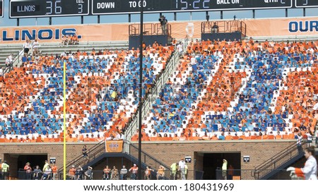 CHAMPAIGN,IL-SEPTEMBER 28: University of Illinois students participate in Dad\'s Day by holding up colored signs during a game on Saturday, Sept 28, 2013.
