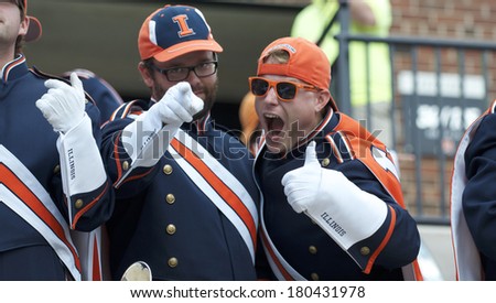 CHAMPAIGN,IL-SEPTEMBER 28: University of Illinois band members pose for the camera in between songs during a game on Saturday, Sept 28, 2013.