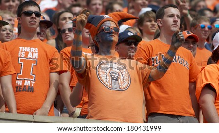CHAMPAIGN,IL-SEPTEMBER 28: A University of Illinois student dressed in team colors watches the Illini battle for a win on Saturday, Sept 28, 2013.