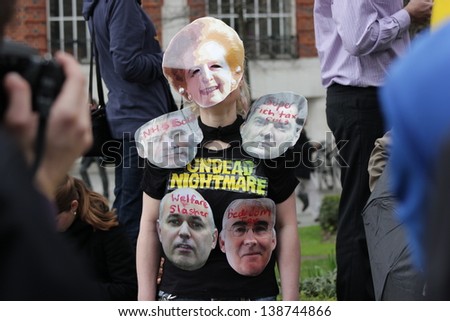 LONDON - APRIL 17: A protestor demonstrates outside the funeral service for Margaret Thatcher at St. Paul\'s Cathedral on April 17, 2013 in London.