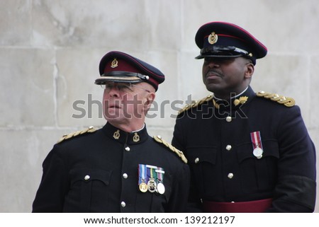 LONDON - APRIL 17: Military officers wait outside the funeral service for Margaret Thatcher at St. Paul\'s Cathedral on April 17, 2013 in London.