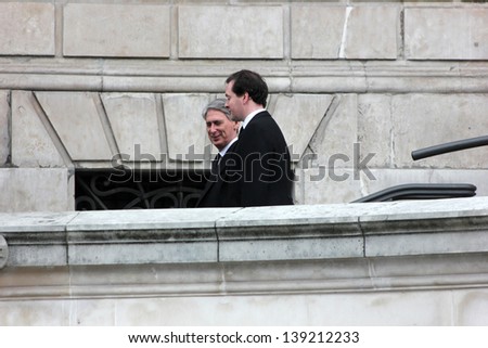 LONDON - APRIL 17: George Osborne and Philip Hammond leave the funeral service for Margaret Thatcher at St. Paul\'s Cathedral on April 17, 2013 in London.