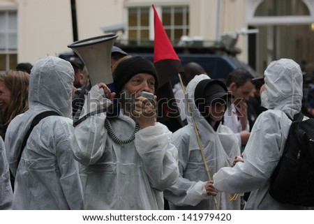 LONDON - June 12: Demonstrators protest arm manufacturing companies and traders, on Pall Mall on June 12, 2013 in London.