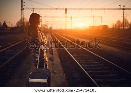 Young traveler woman in railway