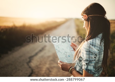 Traveler girl looking map