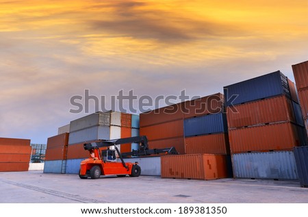 Crane lifter handling container box loading to truck in import export logustic zone