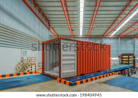 trucks at loading dock shipping industry warehouse