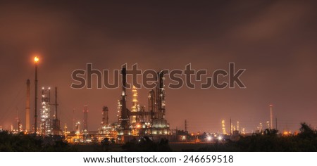 Big Industrial oil tanks in a refinery with treatment pond at industrial plants