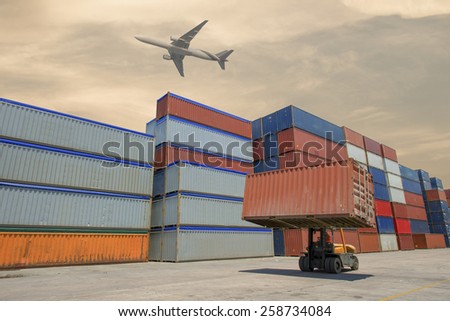 Forklift handling container box loading to truck in import export logustic zone