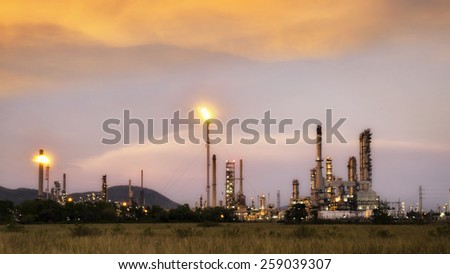 Big Industrial oil tanks in a refinery with treatment pond at industrial plants.