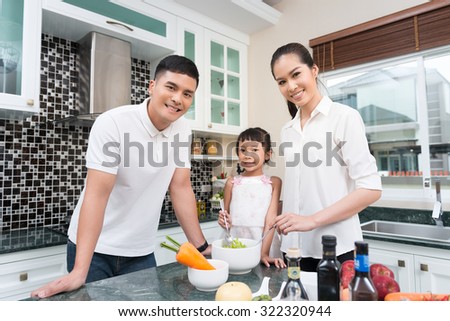 Asian family are cooking in the kitchen at home.