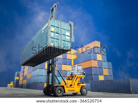 Forklift handling container box loading to freight train
