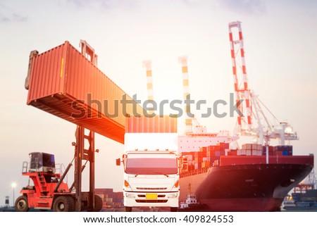 Truck and Container Cargo freight ship with working crane bridge in shipyard at dusk for Logistic Import Export background