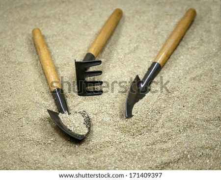 Garden tools on sand