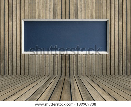 Black blank chalkboard on wood wall for background