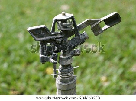 water springer on ground in garden