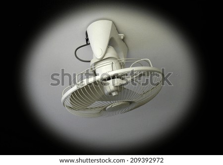 electric fan on white ceiling