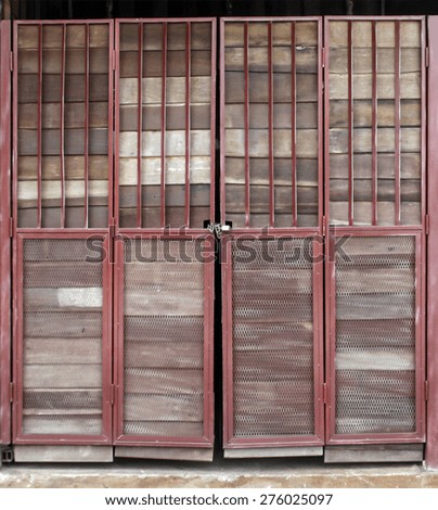 old wood door with iron net