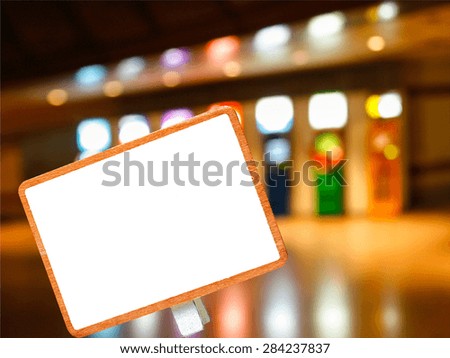 blank blackboard on abstract blurry automatic teller machine or ATM in dim light building