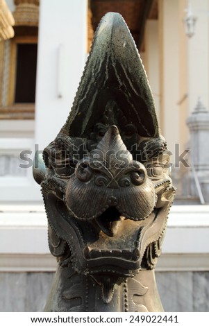 Sing ancient statues made of metal located around the church at Wat Pho, Thailand