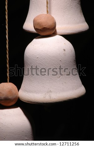 Fragment, ball and bell, of a clay wind chimes