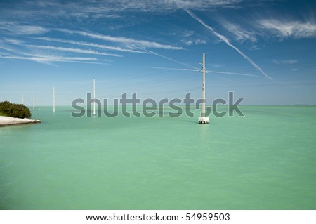 Electric poles in the water of Gulf of Mexico at Florida Keys