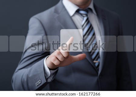 Businessman pressing modern social buttons on a virtual background Businessman pressing modern social buttons on a virtual background