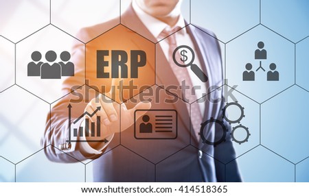business, technology, internet and enterprise resource planning concept. Businessman pressing erp button on virtual screens with hexagons and transparent honeycomb
