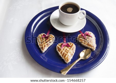 Cookies in the shape of heart on the blue plate. From the series 