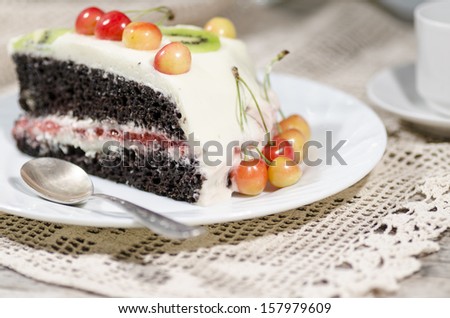 Bird-cherry flour cake with cherries, strawberries and kiwi. Homemade cake. From series \
