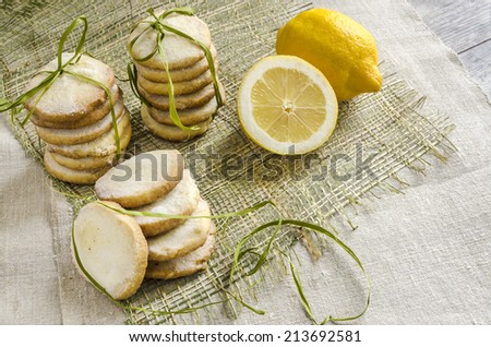Homemade lemon sugar cookies tied up with rope on linen tablecloth From series Winter pastry