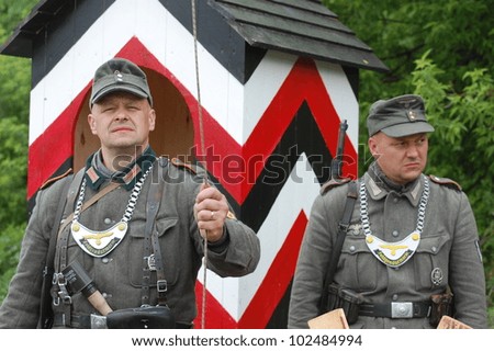 KIEV, UKRAINE -MAY 13: Members of Red Star history club wear historical German uniform during historical reenactment of WWII, May 13, 2012 in Kiev, Ukraine