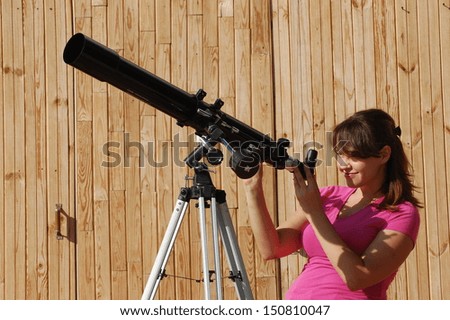 Teen girl and telescope. Near Kiev,Ukraine