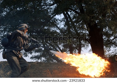 KIEV, UKRAINE - SEPTEMBER 6, 2008:  Person in German WW2 military uniform with flame-thrower.  Historical military reenacting in Kiev, Ukraine, September 6, 2008.