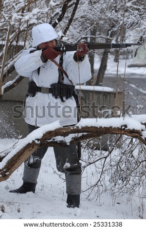 KIEV, UKRAINE - FEB. 20: A member of the history club called Red Star wears a historical German  uniform as he participates in a WWII reenactment. February 20, 2009 in Kiev, Ukraine.