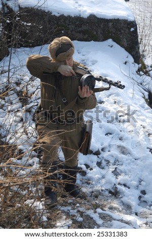 KIEV, UKRAINE - FEB. 20: A member of the history club called Red Star wears a historical Soviet uniform as he participates in a WWII reenactment. February 20, 2009 in Kiev, Ukraine.