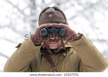 KIEV, UKRAINE - FEB. 20: A member of the history club called Red Star wears a historical soviet uniform as he participates in a WWII reenactment. February 20, 2009 in Kiev, Ukraine.
