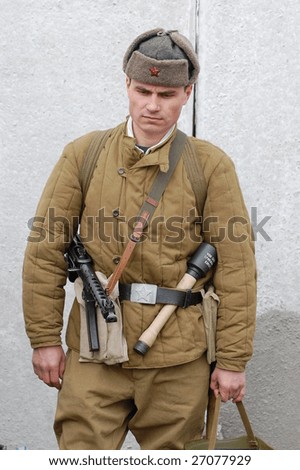 VINNITSA, UKRAINE - MAR. 21: A member of the history club called Red Star wears a historical soviet uniform as he participates in a WWII reenactment. March 21, 2009 in Vinnitsa, Ukraine.