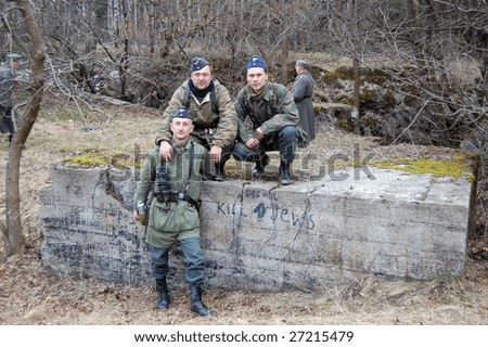 VINNITSA, UKRAINE - MAR 21: Members of a history club  wears a historical German uniform near Hitler\'s secret command post ruins in Vinnitsa, Ukraine March 21, 2009.