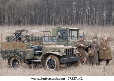VINNITSA, UKRAINE - MAR 21: Members of history club called Red Star wears historical Soviet uniform and drive a truck. WWII reenactment in Vinnitsa, Ukraine on March 21, 2009. .