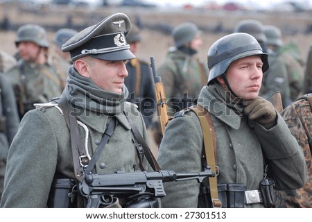 VINNITSA, UKRAINE - MAR 21: Members of a history club called Red Star wear historical German uniform as they participate in a WWII reenactment in Vinnitsa, Ukraine on March 21, 2009.