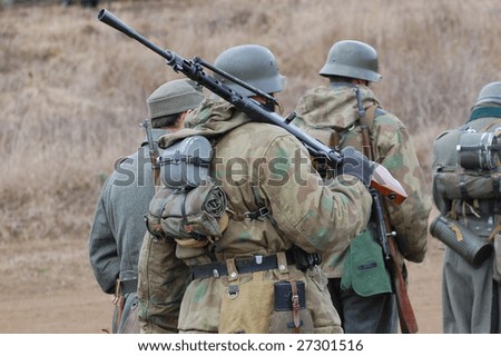 VINNITSA, UKRAINE - MAR 21: Members of a history club called Red Star wears a historical German uniform as he participates in a WWII reenactment in Vinnitsa, Ukraine on March 21, 2009.