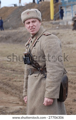 VINNITSA, UKRAINE - MAR 21: A member of history club called Red Star wears historical Soviet uniform as he participates in a WWII reenactment in Vinnitsa, Ukraine on March 21, 2009.