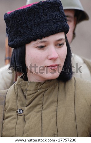 VINNITSA, UKRAINE - MAR 21: A member of history club called Red Star wears historical Soviet uniform as she participates in a WWII reenactment March 21, 2009 in Vinnitsa, Ukraine.