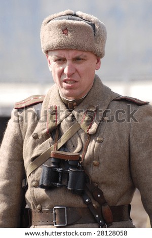 VINNITSA, UKRAINE - MAR 21: A member of history club called Red Star wears historical Soviet uniform as he participates in a WWII reenactment March 21, 2009 in Vinnitsa, Ukraine.